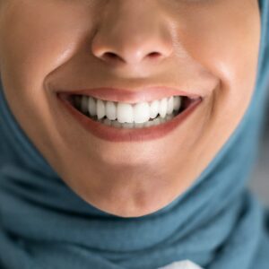 Teeth Whitening. Young Muslim Lady Smiling With Her Healthy White Teeth, Closeup